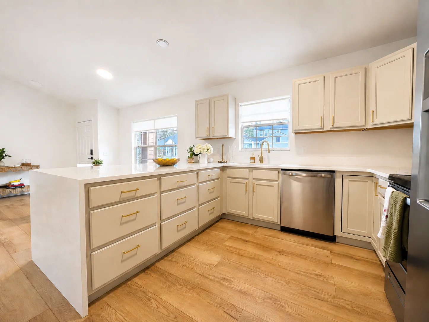 Kitchen cabinetry, quartz counters, and stainless appliances